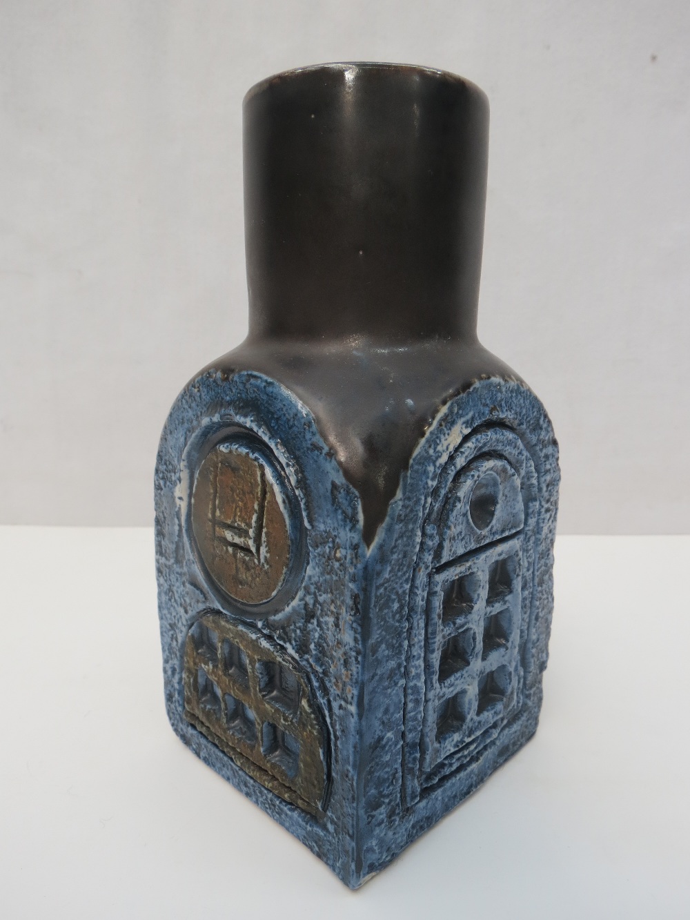 A Troika pottery chimney vase in dark blue and black by FB. Height 15cm.