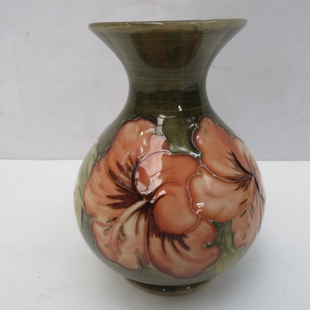 A Moorcroft hibiscus flared neck vase, 13cm, impressed Moorcroft beneath.