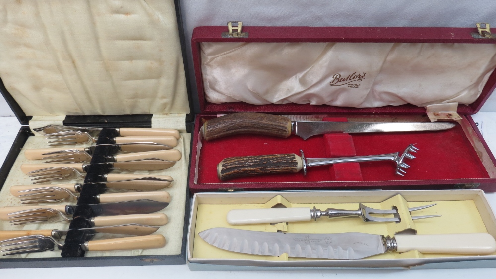 An antler handled carving knife and meat holder by Butlers of Sheffield in once smart case,