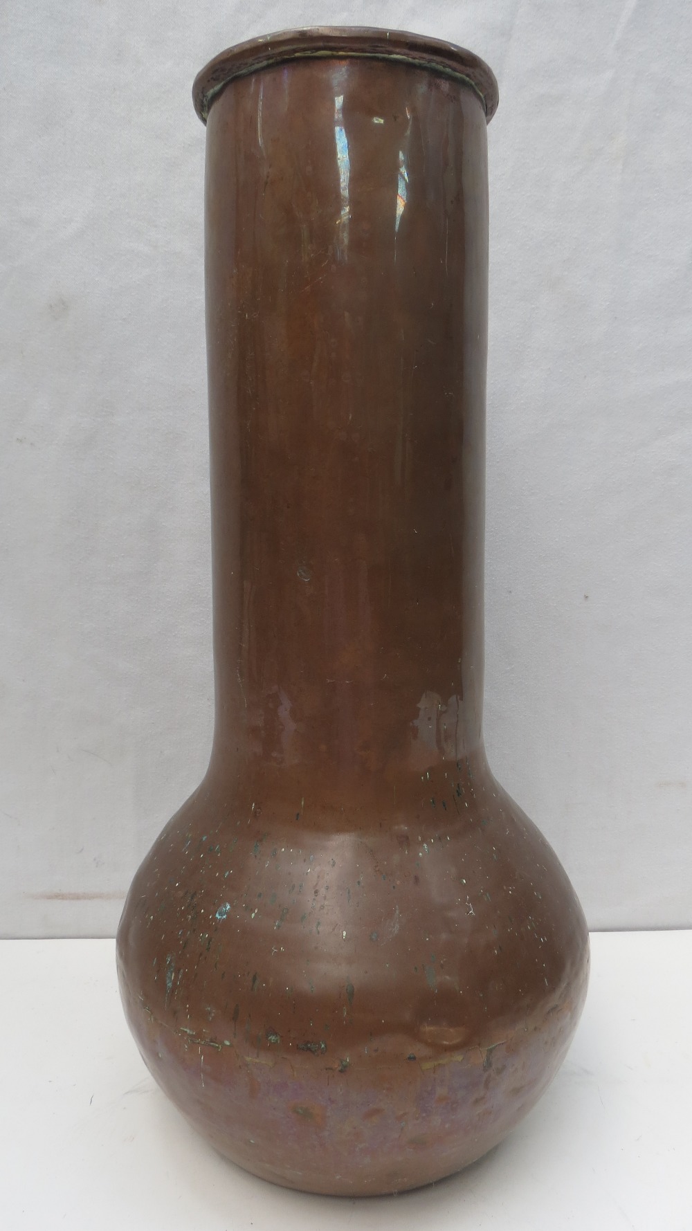 A large hand raised copper vase with bulbous base and cylinder to lip 43cm in height.