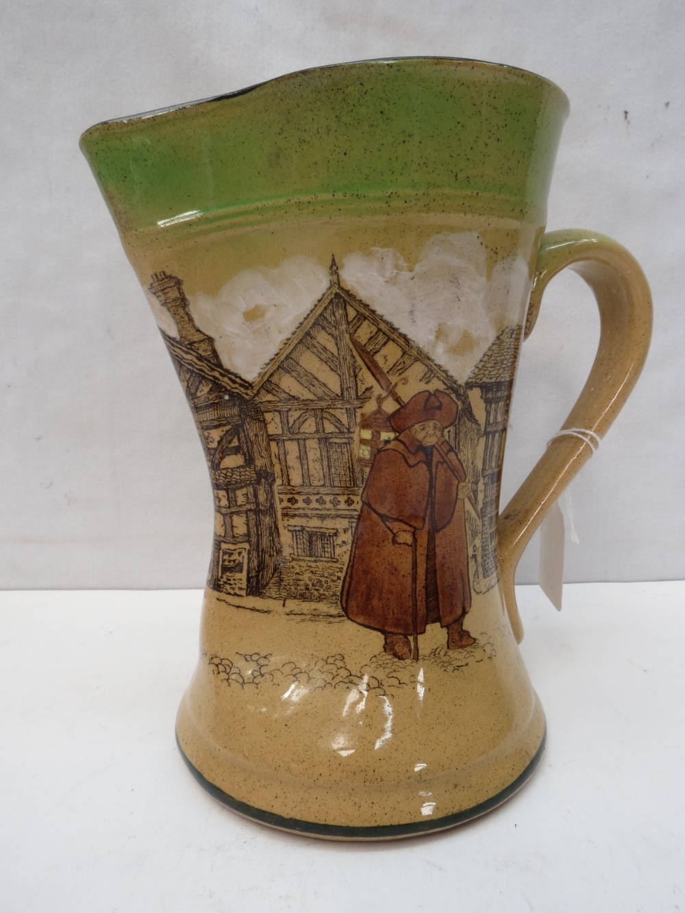 An early Royal Doulton large pinch necked jug decorated with a Victorian street scene, 21cm.