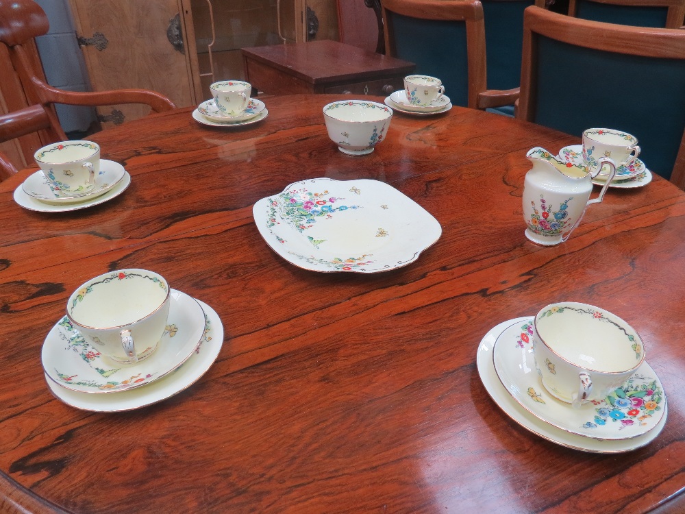 Crown Staffordshire wares to include: tea cups and saucers, a sugar bowl, milk jug and plates for