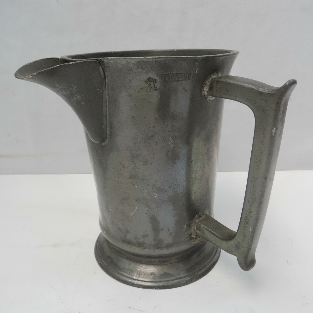 A Victorian  pewter jug marked for one quart with monogram and inscribed beneath 'Rising Sun,