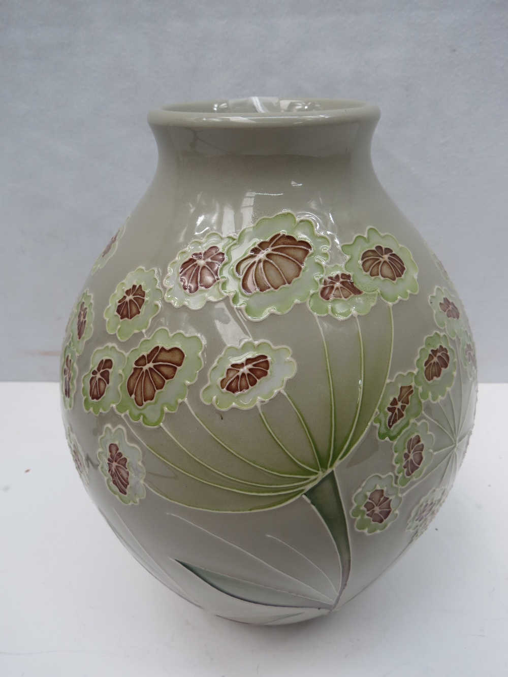 A 2012 edition, Moorcroft grey ground vase with multiple head flowers on delicate stems. 'Trial'