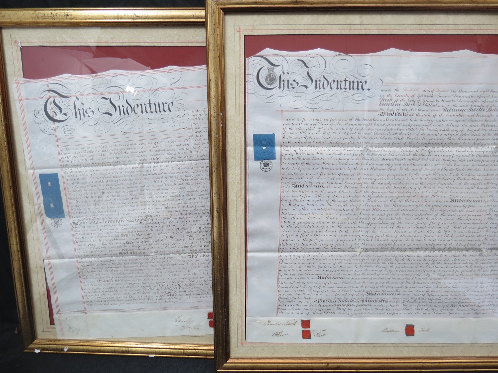 Two large framed Victorian indentures.