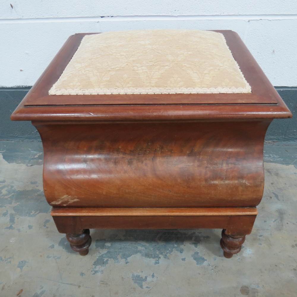 A 19thC walnut step commode the padded top lifting to reveal compartment within complete with