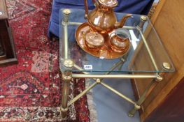 A BRASS FRAMED COFFEE TABLE