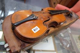 AN ANTIQUE VIOLIN WITH TWO PIECE MAPLE BACK