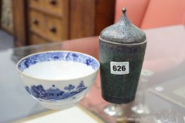 AN ENAMELLED WHITE METAL COVERED JAR AND A BLUE AND WHITE BOWL