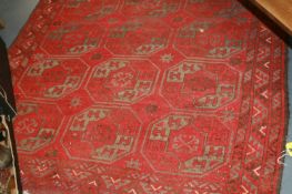 A PERSIAN RED GROUND RUG