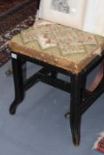 A VICTORIAN EBONISED STOOL