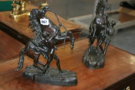 A PAIR OF BRONZE MARLEY HORSES