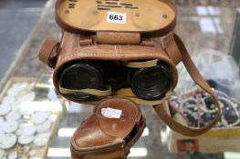 A PAIR OF MILITARY BINOCULARS AND A MILITARY MARCHING COMPASS
