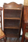 A SMALL OAK BOOKCASE