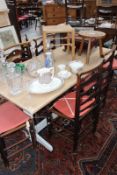 A SMALL OAK REFECTORY TABLE WITH TRESTLE BASE