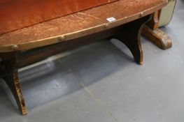 A COPPER TOPPED COFFEE TABLE