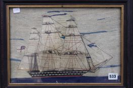 A 19TH CENTURY WOOLWORK PICTURE OF A NAVAL SHIP