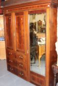 AN EDWARDIAN MAHOGANY INLAID COMPACTUM WARDROBE