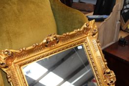 A GILT FRAMED MIRROR AND A ROBING MIRROR