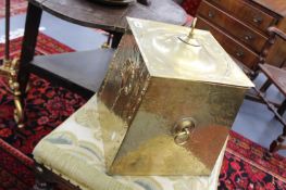 A BRASS COAL SCUTTLE