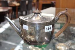 AN ANTIQUE HALLMARKED CRESTED SILVER OVAL TEAPOT