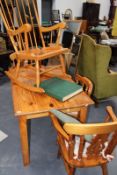 A PINE KITCHEN TABLE AND CHAIRS AND A ROCKING CHAIR