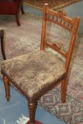 A SET OF SIX VICTORIAN OAK SIDE CHAIRS WITH BUTTON LEATHER SEATS