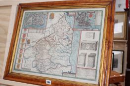 AN ANTIQUE MAPLE FRAMED HAND COLOURED MAP BY JOHN SPEED