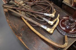 THREE ANTLER HANDLED RIDING CROPS AND ONE OTHER