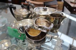 AN ANTIQUE HALLMARKED SILVER TEAPOT, A THREE PIECE TEA SET, TWO CREAM JUGS AND A SAUCE-BOAT