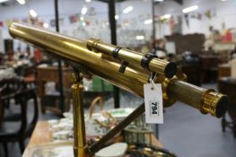 A LARGE EARLY 20TH.C.BRASS TELESCOPE ON ORIGINAL TRIPOD STAND WITH WOODEN TRANSIT CASE