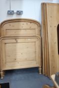 A PAIR OF CONTINENTAL PINE SLEIGH BEDS