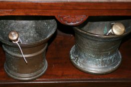 TWO LARGE BRONZE MORTAR AND PESTLE