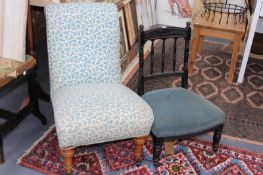 AN EBONISED NURSING CHAIR AND A VICTORIAN DEEP SEAT NURSING CHAIR ON TURNED LEGS
