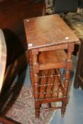 AN ARTS AND CRAFTS OAK BOOKCASE TABLE PROBABLY LIBERTY`S