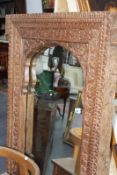 A LARGE HARDWOOD FRAMED MIRROR