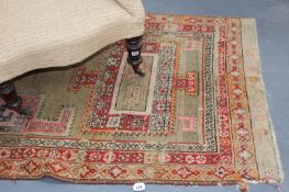 A PERSIAN RUNNER AND TWO SMALL RUGS