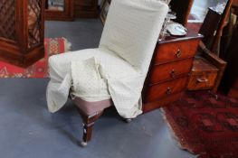 A PAIR OF SMALL BEDSIDE CHESTS AND A NURSING CHAIR