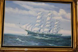 A GILT FRAMED OIL ON CANVAS SAILING SHIP IN HIGH SEAS