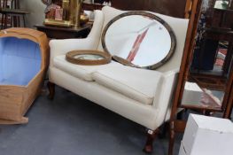 AN EDWARDIAN SMALL TWO SEAT WING BACK SETTEE