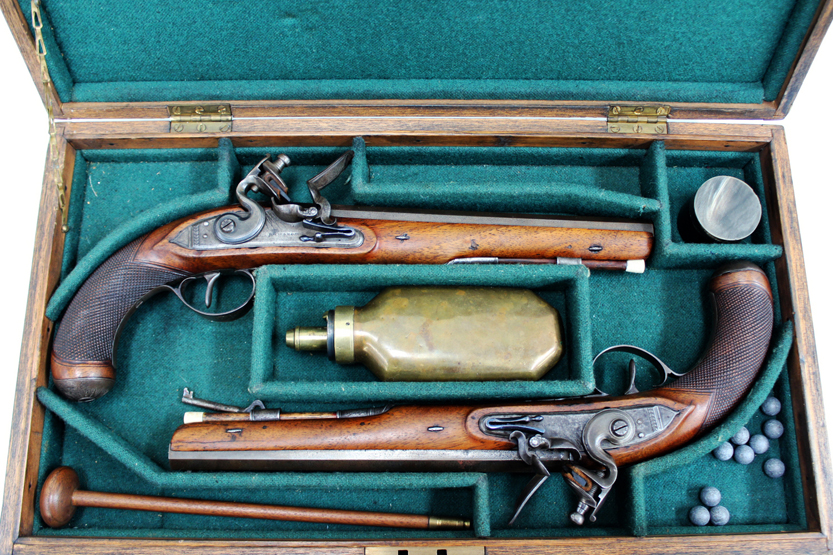 A cased pair of flintlock Officer`s pistols by Richardson of Manchester, 9inch sighted octagonal