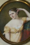 A 19TH.C.CONTINENTAL SCHOOL OVAL MINIATURE PORTRAIT OF A YOUNG LADY IN EMPIRE DRESS. SIGNED DUPUY.