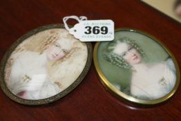 TWO VICTORIAN OVAL MINIATURE PORTRAITS OF YOUNG LADIES. WATERCOLOUR