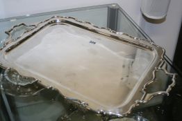 A LARGE HALLMARKED SILVER OVAL RECTANGULAR SHAPED EDGE TWO HANDLED TRAY.