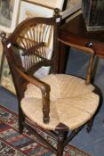 A PAIR OF RUSH SEAT SPINDLE BACK ARMCHAIRS