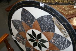 AN INLAID MARBLE CIRCULAR TABLE TOP