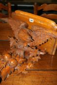 A VICTORIAN CARVED OAK CLOCK BRACKET