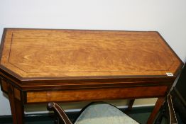A REGENCY SATINWOOD AND MAHOGANY BANDED FOLD OVER CARD TABLE