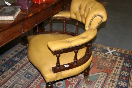 A VICTORIAN LEATHER UPHOLSTERED ARMCHAIR