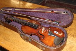 AN ANTIQUE VIOLIN IN PERIOD CASE WITH TWO BOWS